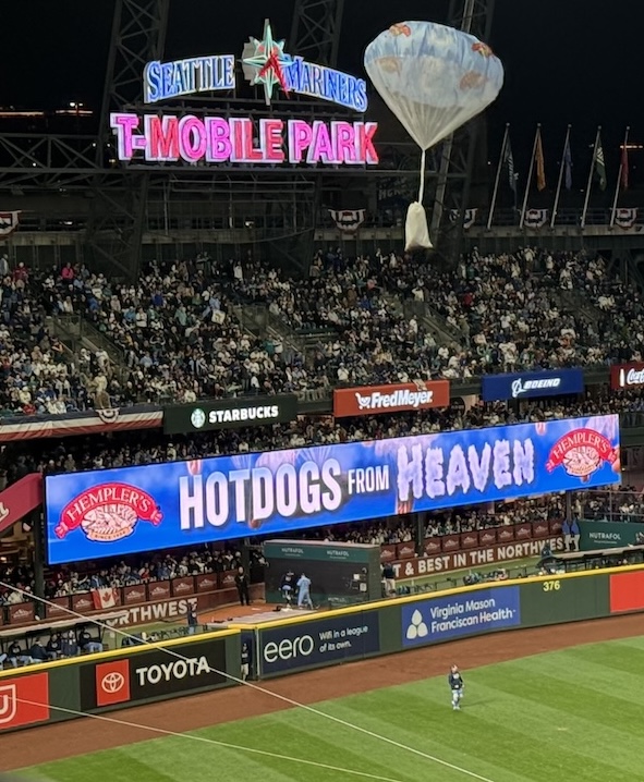 Hotdogs being parachuted into T-Mobile park during the 7th inning stretch.