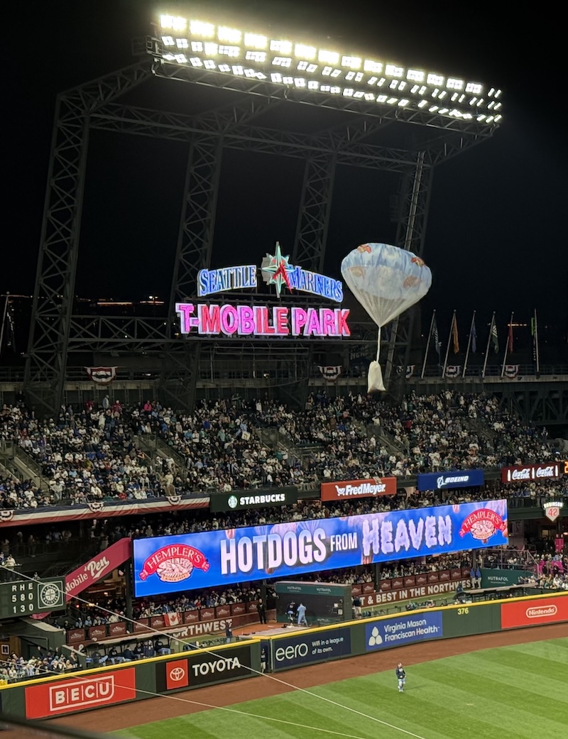 Hotdogs being parachuted into T-Mobile park during the 7th inning stretch.